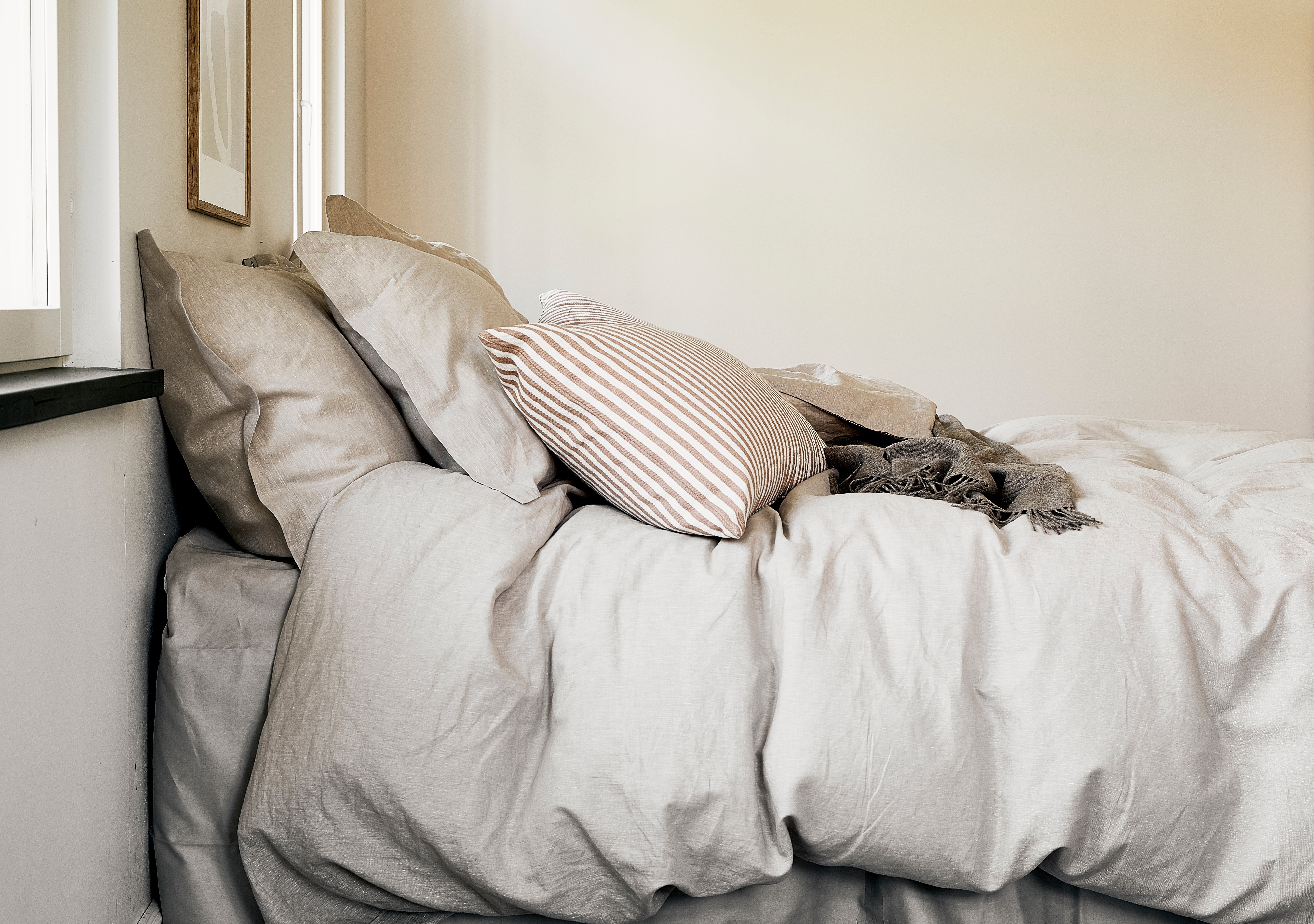 A bed, with down pillows and down duvet