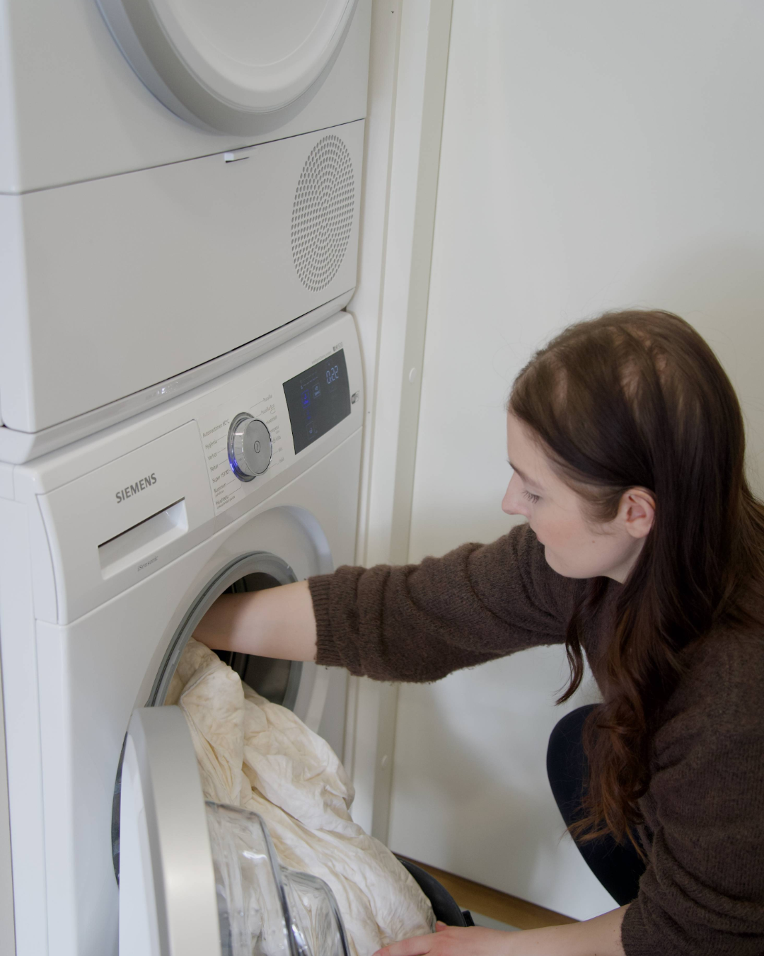 A wet and washed down duvet coming out of washing machine